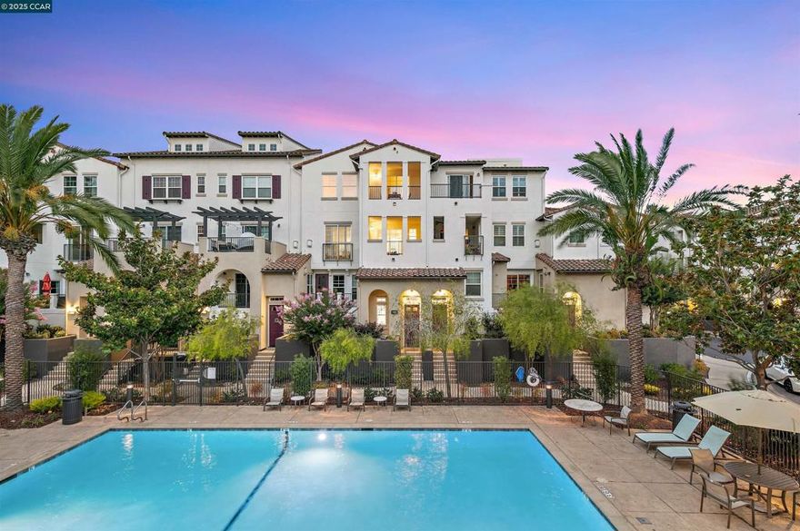 Welcome to 4258 Clarinbridge Circle! This Mediterranean-inspired home is all about easy living with a touch of luxury and Melrose Place. Featuring an open view overlooking the greenbelt and pool,  it’s perfectly placed in the heart of coveted Dublin Ranch—close to shopping, dining, parks, express bus to BART and top-rated schools.  Inside, hardwood floors flow through an open layout where the chef’s kitchen with stainless steel appliances and a big island connects right into the living room with its cozy gas fireplace. Step out to your covered balcony and enjoy pool views—ideal for morning coffee or evening unwinding.  Upstairs, the primary suite feels like a retreat with its own balcony, walk-in closet, and spa-style bathroom with dual sinks, a soaking tub, and separate shower. The second bedroom also has its own walk-in closet and plenty of light, with a full bath right nearby.  And don’t forget the extras: a secure 2-car garage, tons of storage, and access to resort-style perks like the pool, hot tub, clubhouse and gym. With tree-lined streets, nearby trails, and quick BART and freeway access, this home makes it easy to love where you live. OPEN SUN