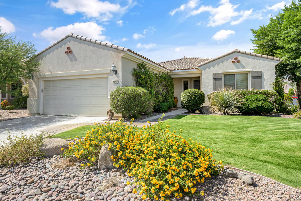 Situated within the prestigious 55+ Active Adult Community of Sun City Shadow Hills, this Avalino floor plan offers 2 bedrooms plus a den, 2 baths, and 1,763 sq. ft. (EST.) of thoughtfully designed living space on a desirable corner lot with a manicured front lawn. Inside, a bright and inviting layout features tile flooring in the main living areas and brand-new carpet in both bedrooms and the den. The gourmet kitchen is appointed with granite countertops, stainless steel appliances, a gas range, double ovens, and abundant cabinetry--perfect for both everyday meals and entertaining guests. The primary suite showcases a spa-inspired bath complete with dual vanities, a step-in shower, and a luxurious soaking tub. The guest bedroom includes a walk-in closet, offering comfortable accommodations for visitors or flexible use as needed. Additional features include an indoor laundry room with upper cabinetry, a covered back patio ideal for alfresco dining or quiet relaxation, and an attached 2-car garage. The backyard is enhanced with low-maintenance desert landscaping, allowing you to enjoy the outdoors with minimal upkeep. Residents of Sun City Shadow Hills enjoy access to two championship golf courses, resort-style clubhouses, state-of-the-art fitness centers, pools, tennis and pickleball courts, and an abundance of social clubs and activities--creating a vibrant and engaging lifestyle.