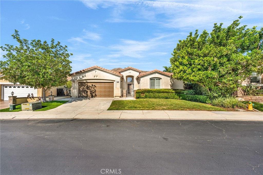 FOUR SEASONS HEMET 55+ COMMUNITY – BEAUTIFULLY MOVE-IN READY HOME! Looking for comfort, style, and resort-style living? This desirable Championship 3 floor plan in the prestigious Four Seasons Hemet 55+ community features 3 generously sized bedrooms, a spacious Den/Office, and 3 full bathrooms—offering plenty of room for family and guests. Recent upgrades include newer laminate flooring throughout the Living Room, Family Room, Bedrooms, and Den/Office, tile flooring in the Entryway, Bathrooms, and Kitchen, upgraded cabinetry in the Primary Bath and in the bathroom near the Laundry Room, fresh interior paint throughout with crisp white baseboards, and elegant plantation shutters on most windows. Step outside to your own private retreat with a large backyard, tranquil fountain, and an expansive Alumawood patio cover—perfect for relaxing or entertaining. Four Seasons Hemet is a gated community built around an 18-hole championship golf course and offers resort-style amenities at The Lodge, including a bistro, hair and nail salon, library, computer room, card room, billiards room, banquet hall, theater with free movies three times daily, a state-of-the-art fitness center, Olympic-size swimming pool and spa, outdoor BBQ area, and dozens of social clubs and travel opportunities. With a low monthly HOA fee and all these exceptional amenities, this home offers incredible value in one of Hemet’s most sought-after 55+ communities. Don’t miss your chance to live the lifestyle you’ve been dreaming of—schedule your private tour today!