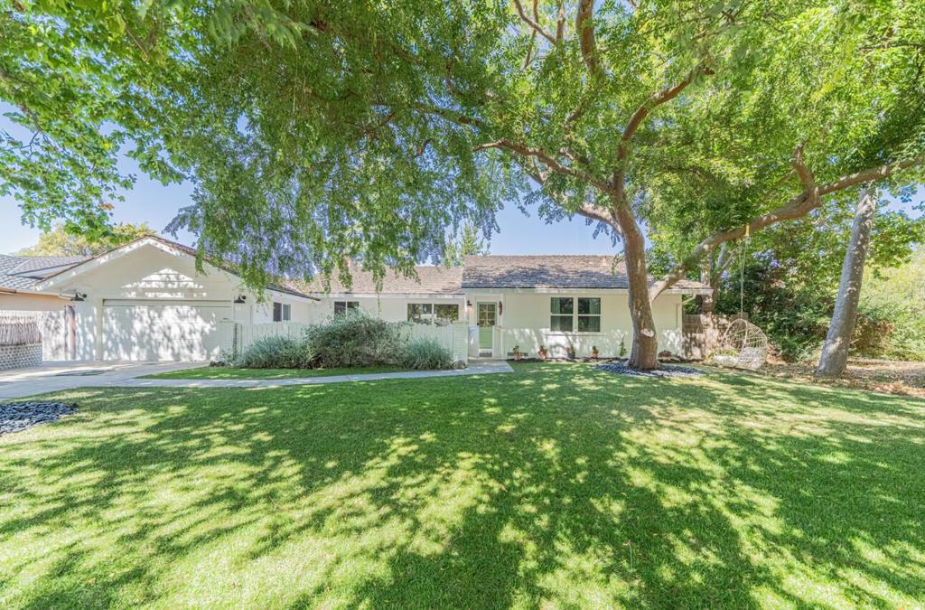 Welcome to this beautifully maintained 3 bedroom 2 bathroom single story home on a private corner lot in the highly sought after Toro Park community. The property features original hardwood floors throughout the main living areas and a dramatic vaulted ceiling in the living room, creating a bright and open central gathering space. The completely renovated primary bathroom showcases high-end finishes and thoughtful design. An inviting front porch enhances curb appeal, while the backyard deck, lawn and raised bed planter boxes provide a perfect setting for outdoor living and entertaining. The home also includes an attached two car garage for convenience. With tasteful upgrades and meticulous care this home is truly move in ready. Its location offers easy access to parks and trails, making it a wonderful opportunity for buyers seeking comfort, style and convenience.