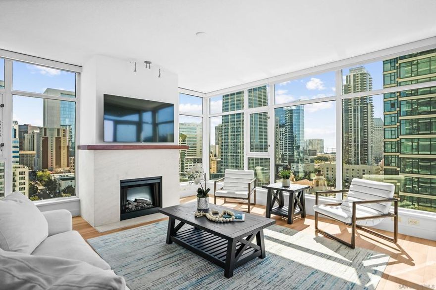 Experience elevated coastal living in Residence 1505 at The Grande North at Santa Fe Place, an exceptional corner residence with stunning views of San Diego Bay, the Coronado Bridge, and the city skyline. This beautifully 2-bedroom, 2-bath home features hardwood floors, expansive walls of windows, and a private terrace ideal for enjoying the sail boats pass by and vibrant city life. The chef’s kitchen is equipped with GE stainless steel appliances, granite countertops, and ample storage. Additional features include a full-size washer and dryer, custom window shades, surround sound, and private parking for two cars. Located in the prestigious Columbia District, residents are just minutes from the Embarcadero, Little Italy, Seaport Village, and the Gaslamp Quarter. Residents enjoy a full suite of luxury amenities, including 24-hour concierge and security, a state-of-the-art fitness center, a recently renovated 80’ lap pool, jacuzzi, steam and sauna rooms, bicycle storage, and a fully appointed guest suite with parking. The elegant Club Room features a full kitchen, entertainment area, and bar, making it the perfect space for larger gatherings.