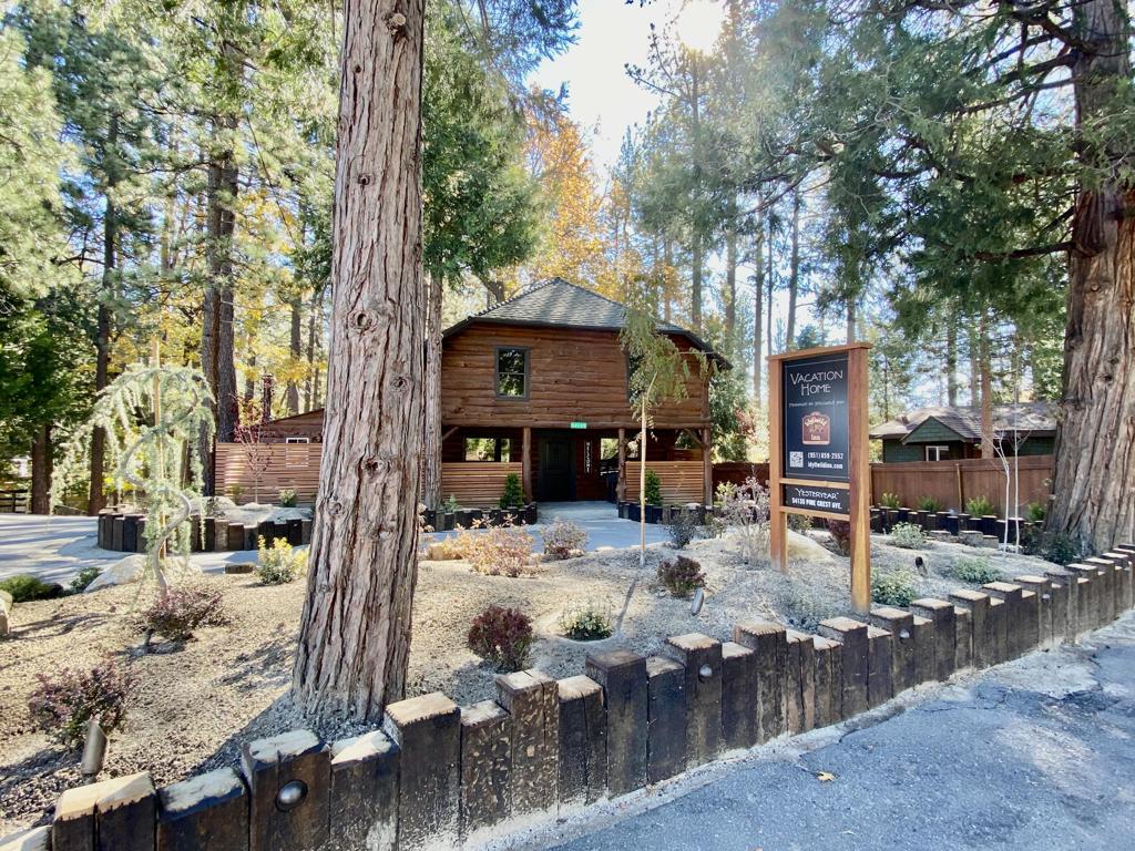 Experience the timeless appeal of mountain living in this rustic 3-bedroom, 2-bath log home, ideally situated right in the heart of Idyllwild. With nearly 1,900 square feet, this spacious residence offers a welcoming blend of classic charm and modern updates. Step inside to a generous living room anchored by a massive rock fireplace-perfect for gathering on cool evenings-while a separate family room with a cozy wood stove provides additional space to relax or entertain. Newer central heating and air conditioning ensure year-round comfort, and the large, usable yard with a circular drive offers plenty of parking and room to enjoy the outdoors. Unique for in-town properties, this home sits on sewer and has ample space at the rear for adding an accessory dwelling unit (ADU), making it an excellent option for those seeking room to grow or invest. Enjoy all the conveniences of living close to Idyllwild's shops, dining, and community events, while savoring the peace and privacy of your own mountain retreat.