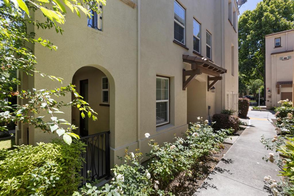 Light, updated & meticulously maintained luxury end unit in the highly sought-after Mondrian complex built by Shea Homes. Lots of natural light & tastefully enhanced with freshly painted walls, white wood cabinets, and new carpeting. The main level features a living/dining area w/ a gas fireplace, a balcony w/ a tempered glass wall, upgraded hardwood floors, a large open designer kitchen w/ an island near a half bath, laundry area, & an office nook. High-end stainless-steel appliances w/ new gas cooktop, contemporary granite countertops & backsplash. The upper level consists of an over-sized master-suite w/ a walk-in closet, a large shower, dual sink vanity, & a 2nd ensuite bedroom. The first level offers a conveniently located third ensuite bedroom/den w/ a custom Murphy bed & a private patio. Finished two-car garage has white custom California Closet organizers & epoxy floors. The property is pre-wired for voice, data, cable &, surround sound on the main level, equipped w/ a 3 zoned AC/Heating system, & an extra insulation on front/back exterior walls. Mondrian offers a well-maintained tree-lined community that features a pool, spa, playground, lawns, & guest parking. Near downtown MV & Caltrain station w/ easy access to all the major freeways, High-tech firms, farmers market.
