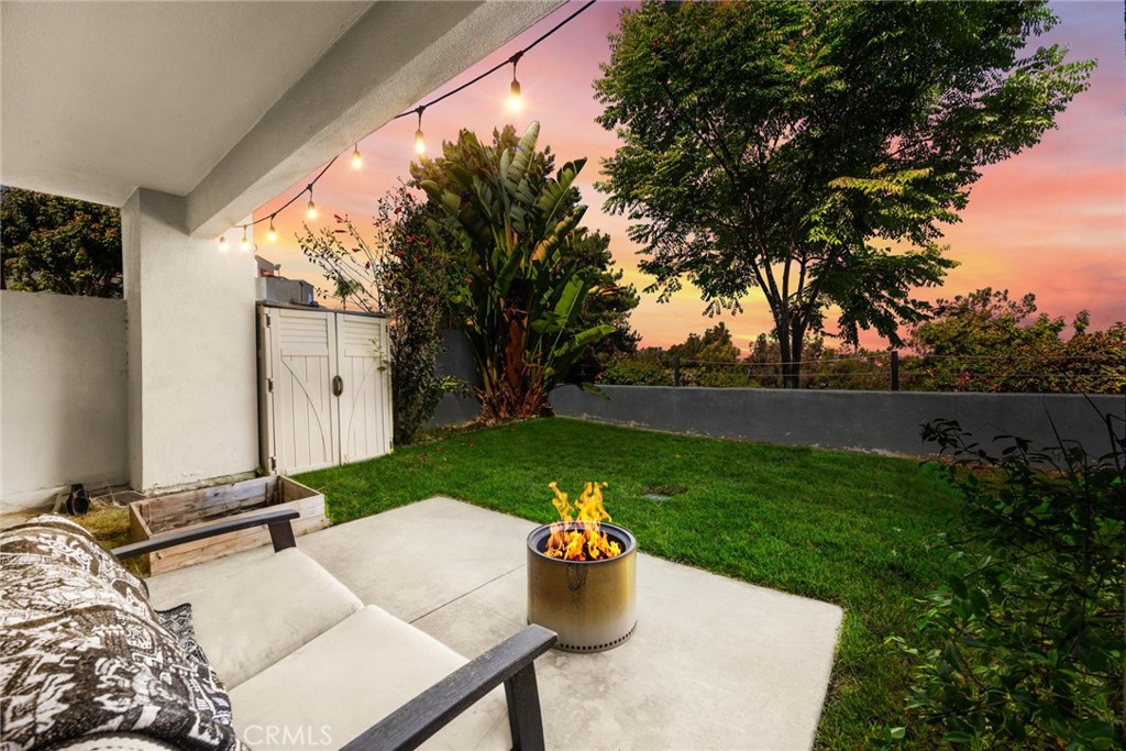 Welcome to 26925 Jasper – a charming Mission Viejo condo that feels like a hidden gem in Southern California living. This spacious 2-bed, 1 1/4-bath haven showcases comfort, style, and a rare slice of private outdoor space—perfectly blending indoor sophistication with outdoor serenity. Step into a tranquil living room with warm wood-style luxury vinyl flooring, cozy fireplace, and sliding glass doors that frame sweeping views and bring the outdoors in. Enjoy meals in the recently renovated kitchen, complete with sleek granite countertops, stainless-steel appliances, crisp, white cabinets, and recessed lighting. The primary bedroom features a generous walk-in closet, overlooking the backyard oasis which creates a peaceful retreat. The full bathroom is elegantly updated with a neutral tile, contemporary vanity, and polished fixtures—serving both bedrooms in modern style. A second nice-sized room provides versatility for buyers who can utilize this space as an office or bedroom. One of the most sought after features of this unit is its own private backyard—a rarity in Mission Viejo condos. Enjoy morning coffee or evening wine in a cozy, shaded outdoor patio with sweeping, cool breezes. A manicured green space is perfect for pets, kids, or gardening enthusiasts. This home overlooks mature landscaping and city lights in the evenings—an inviting backdrop for every season. Another distinguishing feature of this condo is its direct garage access, a highly practical amenity that provides convenience. Nestled in a friendly, well-maintained complex with ample parking, this property offers easy access to shopping, beaches, dining and entertainment in Mission Viejo. Nearby parks, nature trails, the famed Mission Viejo Lake in addition to being a commuter-friendly location near the 5 and 241 freeways make this a coveted residence. 26925 Jasper delivers the rare trifecta: an updated interior, stunning views, and a private backyard retreat—all within a meticulously managed community. Whether you’re a first-time homebuyer or looking to downsize without compromise, this condo checks every box.
