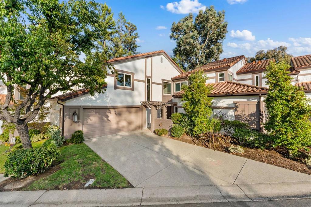 112 El Olivar presents a rare opportunity to own a 4-bedroom, 2.5-bath townhouse in the highly sought-after gated community of Rinconada Hills, offering 1,747 sq ft of move-in ready living. Originally a model home, this residence features a bright, open floor plan with new flooring throughout, new bathroom vanities, a chef's kitchen with stainless steel appliances and a breakfast bar island, and front and back patios providing private outdoor spaces for entertaining or relaxing. Set on a large, private lot, this home combines functional living with style and comfort, while offering access to unparalleled resort-style amenities including 10 swimming pools and spa areas, tennis and pickleball courts, bocce courts, a man-made lake with cascading waterfall, and 107 acres of landscaped walking and jogging trails. Located just minutes from downtown Los Gatos with boutique shops, restaurants, farmers markets, award-winning schools, and recreational destinations such as Vasona Lake Park and Los Gatos Creek Trail, this residence delivers a unique blend of secure, serene living, resort-style community features, and convenient access to Silicon Valley.