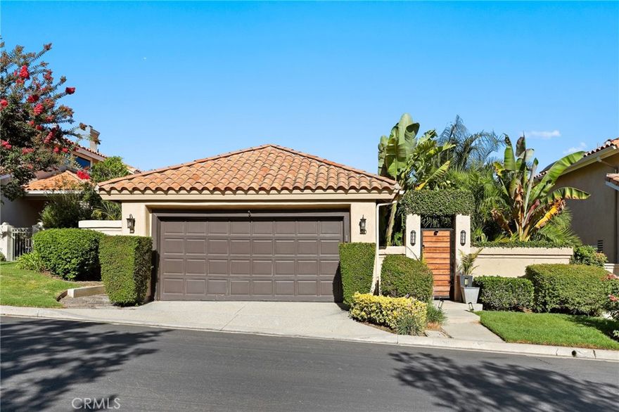 Welcome to 90 Via Candelaria, a truly rare offering in the prestigious gated community of Coto de Caza. One of only 30 single-story ranch-style homes in the entire community, this residence stands out in both exclusivity and design. Ideally located on the northern side of Coto, it is just minutes from the RSM shopping plaza and Coto Sports Park. With no homes in front or behind, the property offers unmatched privacy, serenity, and sweeping 180-degree views of the golf course, lake, Saddleback Mountains, and Caspers Wilderness Park. Evenings are especially magical, with no light pollution and the rare chance to stargaze under open Orange County skies. Inside, the home showcases vaulted ceilings, real hardwood floors, recessed LED lighting, and ceiling fans in every major room. The living area features a custom white tile wall with an electric fireplace, complete with built-in speaker wiring and TV mount. The kitchen is appointed with freshly painted white cabinetry, stainless steel appliances, and new lighting. The primary suite includes sliding doors to the backyard oasis, crown molding, dual sinks, a walk-in shower, and custom lighted bathroom mirrors. Additional enhancements include automated irrigation, custom front gates, upgraded hallway and bathroom lighting, and a pet-friendly backyard fence with a stone path leading directly to the golf course. The highlight of this home is the spectacular backyard, where over $150,000 has been invested in creating a tropical paradise. The landscape features more than 100 palm trees—including 40+ rare species sourced from across California. These palms have been grandfathered in, making this the only property in the Terraces permitted such plantings. Fruit-bearing lemon, orange, lime, and apple trees add to the lush setting. Bamboo fencing, layered palms, and LED flame solar lighting complete the oasis, offering shade by day and ambiance for evening entertaining. Residents of the Terraces enjoy a private pool and spa, while Coto de Caza offers world-class amenities including the Golf & Racquet Club with tennis, pickleball, pools, spas, dining, and fitness center, as well as equestrian facilities, a sports park, and miles of scenic trails. More than a home, 90 Via Candelaria is a rare single-story retreat offering privacy, exclusivity, and natural beauty in the heart of Coto de Caza.