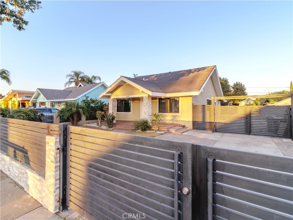 Welcome to 1435 Orange Ave, this charming Craftsman bungalow was built in 1923 and is located in the established Madison Park neighborhood of Southeast Santa Ana. The seller purchased the property and immediately set out to improve its condition.
The updated features include a renovated kitchen and bathrooms, new laminate flooring, new paint, new recessed lighting, stainless steel appliances, a new HVAC system, a new wrought iron fence and gates, and many more upgrades.
This amazing property is perfect for a large family. The main home has three bedrooms, one full bath, a large living room and dining room combination, a galley kitchen with an adjacent laundry room, and a huge loft on the second story. There’s also an attached one-bedroom, one-bath ADU with a separate entrance that can generate income.
The exterior features include a mature landscape and plenty of room for improvement , with a lot size of approximately 7,500 square feet. This provides ample space for adding on more living space. The home also has a new wrought iron fence that offers privacy and security, and a large driveway that can accommodate multiple cars and RV parking.
Note: the sellers purchased the house as it currently stands, buyers to satisfy their own needs about any and all permits.