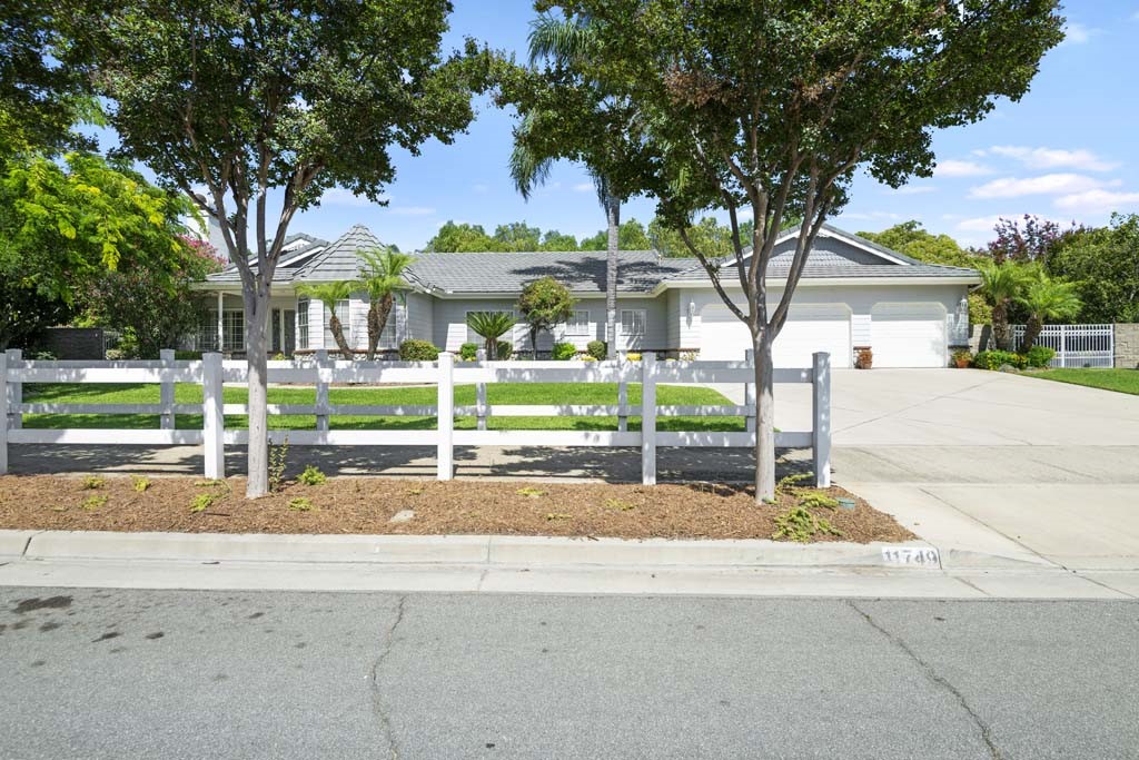 Welcome to 11749 Concord Ct., a beautifully maintained 4-bedroom, 2.5-bath, stunning Single-Story ranch-style home nestled on a quiet cul-de-sac in one of Chino’s most desirable neighborhoods. Set on an expansive 20,000+ sq ft lot, this property offers a rare combination of privacy, space, and versatility—perfect for families, entertainers, or anyone seeking room to grow. Step inside to discover a thoughtfully designed layout that includes a private family room, tucked away from the rest of the home—ideal for movie nights, a home office, or multigenerational living. The spacious kitchen and dining areas flow seamlessly into the main living spaces, creating a warm and welcoming atmosphere. Outdoors, your private oasis awaits. Enjoy the sound of your own backyard waterfall, relax under the shade of mature trees, or take full advantage of the RV parking and 3-car garage—a dream setup for hobbyists, adventurers, or anyone needing extra storage.