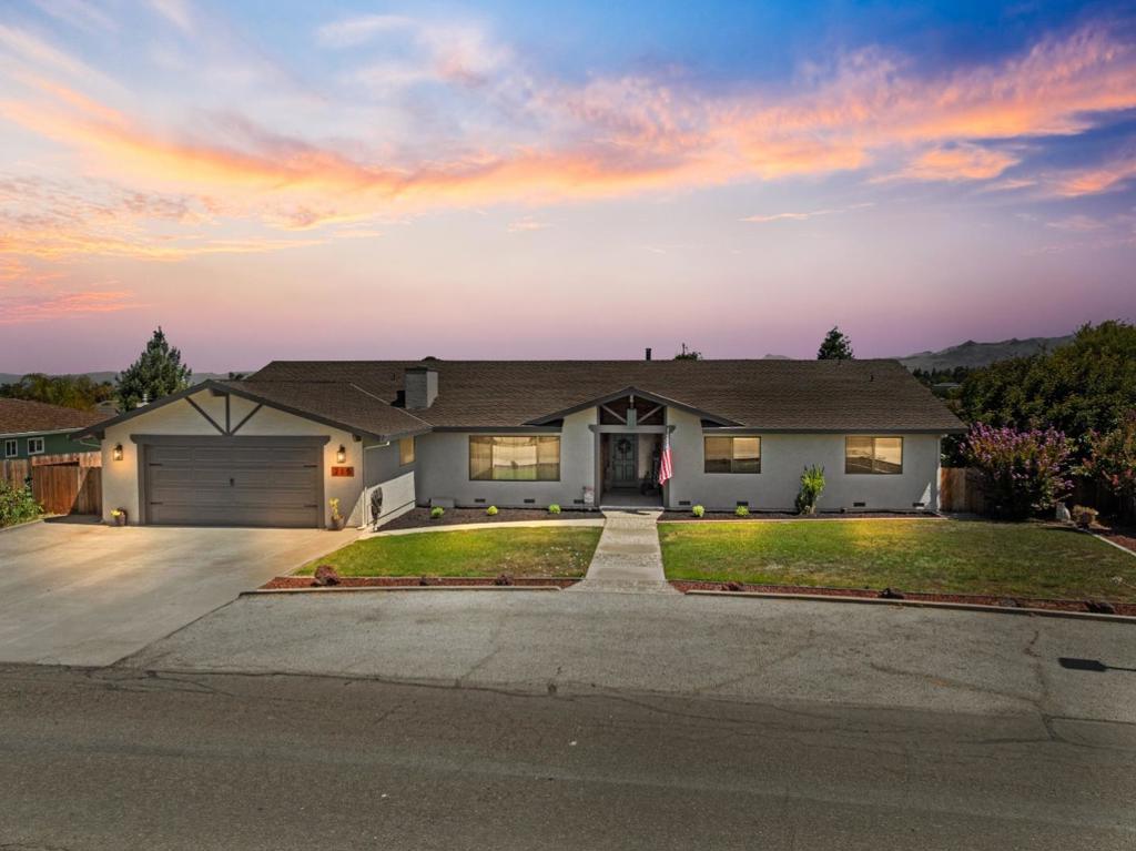 Walk into warmth and beauty. Located in one of the most desirable neighborhoods, this spacious single-story home sits on a generous 16,000+ sq ft lot and is filled with natural light throughout. Featuring an open yet cozy floor plan, this 4-bedroom, 2.5-bath residence is perfect for both everyday living and entertaining. Enjoy a 3-car tandem finished garage with epoxy floors and a bonus workshop - ideal for your hobbies, gym, or extra storage. The new kitchen is a showstopper, complete with a skylight over a large island, enormous walk-in pantry, and all-new appliances. A galley-style laundry room with built-in cabinetry and an extra utility room adds both functionality and convenience. Step outside to find mature landscaping including a persimmon tree, vibrant rose bushes, garden spaces, and ample room to create your backyard oasis - with scenic views of the nearby hills. Additional highlights: New interior and exterior paint, New flooring and baseboards, Updated primary bathroom with new vanity and floors, Finished garage, Ample guest parking with extra-wide and long driveway with separate gravel front area. This charming, one-of-a-kind home offers space, style, and serenity. Laundry refrigerator, washer/dryer, stove/oven, and microwave are included.