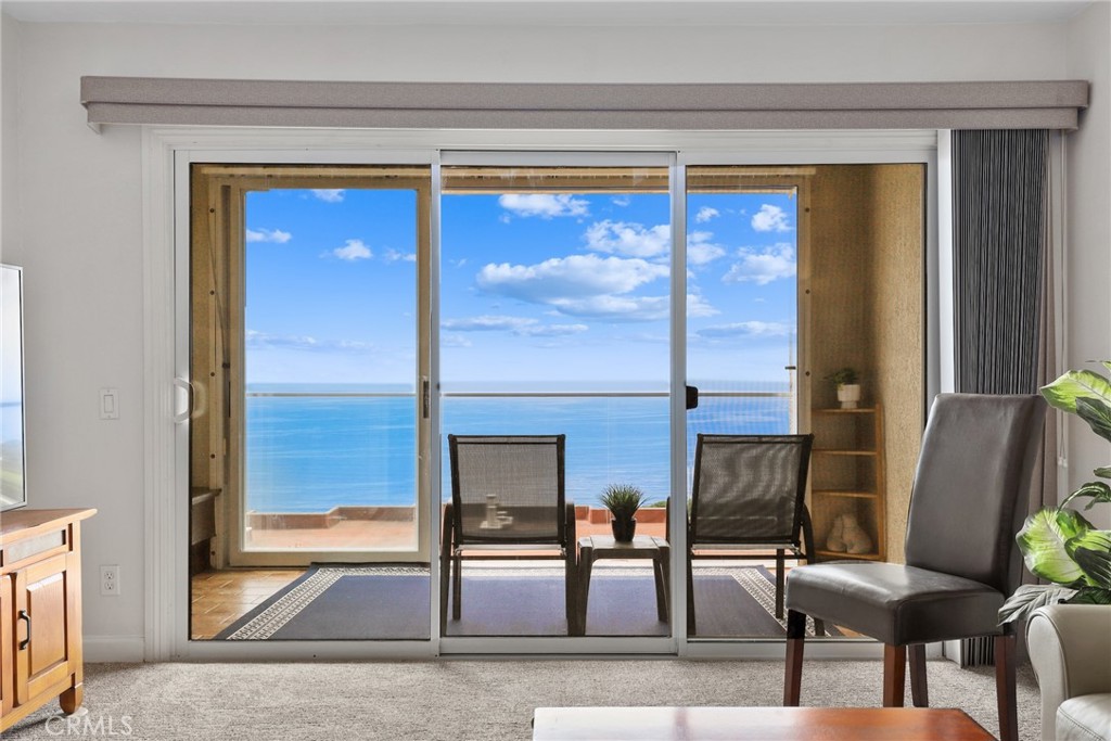 Perched in the highly sought-after Ocean Terrace community of Rancho Palos Verdes, this TOP-Floor, single-level 3bed / 2bath condo offers sweeping 180-degree views of the Pacific Ocean, Catalina Island, and the prestigious golf course. With approximately 1,527 sq ft of beautifully updated living space, this home is designed to maximize natural light, open living, and stunning coastal scenery. A wall of dual-pane sliding glass doors opens to a spacious private balcony - perfect for enjoying ocean breezes, colorful sunsets, and peaceful surroundings. The remodeled kitchen features granite countertops, custom cabinetry, and stainless steel appliances, flowing seamlessly into the dining area and open-concept living room. A cozy fireplace and wet bar add warmth and style. The primary suite is a true retreat, wrapped in windows on three sides to capture the breathtaking views. It includes a walk-in closet, separate vanity area, and a private ensuite bath. A side-by-side laundry setup is conveniently tucked inside a hallway closet between the primary and two additional bedrooms. Ocean Terrace offers a truly resort-style lifestyle, with amenities including a heated pool, spa, two tennis courts, pickleball/paddle tennis court, shuffleboard, fitness center, sauna, billiard room, and a clubhouse for gatherings. Two assigned parking spaces and a large storage closet are conveniently located near the elevator in the secured garage. HOA dues include water, gas, trash, sewage, on-site staff, and beautifully maintained grounds. Located on a quiet cul-de-sac, this home is just moments from scenic coastal hiking trails, secluded beaches, and hidden ocean coves. You’re also close to the renowned Terranea Resort & Spa, Los Verdes Golf Course, local parks, beaches, dining, and shopping - all within the TOP-RATED, award-winning Palos Verdes school district. Don’t miss this rare opportunity to embrace quiet, scenic, and endlessly relaxing coastal living. Schedule your private tour today!