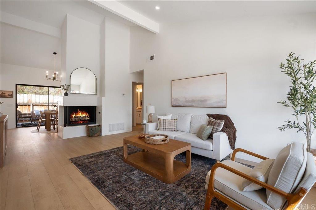 Introducing this fully remodeled 2-bedroom home in the highly sought-after Nob Hill 55+ community. Every detail has been thoughtfully updated, creating a modern and comfortable retreat. Step inside to find vaulted ceilings and a spacious floorplan filled with natural light. The home features luxury vinyl plank flooring and recessed LED lighting throughout. The kitchen shines with modern oak cabinets, quartz countertops, and brand-new appliances, offering a clean and contemporary look. Both bathrooms have also been remodeled, with the primary suite showcasing a double vanity with linen storage and a tiled shower, while the guest bath features all-new vanities and fixtures. Additional upgrades include new doors, hardware, exhaust fans, a freshly stuccoed fireplace front, and a new garage door on the finished garage. Sliding glass doors off the dining room open to a private patio, and drought-tolerant landscaping adds curb appeal out front. Community amenities include a pool, spa, and RV parking. Plus, the home is just minutes from shopping, dining, and entertainment in downtown Vista, adding to its convenience and appeal. With its stylish upgrades, thoughtful details, and prime location, this Nob Hill gem is move-in ready and waiting for its next chapter.