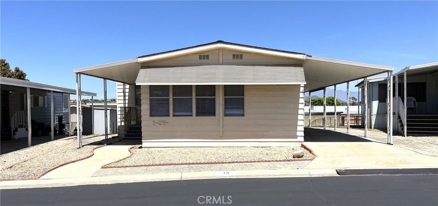 Welcome to Villa Magnolia, a 55+ Gated Community in the city of Riverside. This 2 bedroom and 2 bathroom has upgrades both on the interior and exterior. A beautiful kitchen that opens to the large living room has new cabinets, quartz countertop, sink, faucet, and stainless steel appliances: built-in microwave oven, oven/range, dishwasher, and refrigerator. The home is bright and airy with new interior paint and laminate flooring throughout with carpet in the (2) bedrooms, both bathrooms have quartz countertops, new fixtures, and new toilets. A laundry area is off the kitchen and is equipped with hook-ups for a full-size washer and dryer. The home also has central a/c and heating, a large carport, and a low maintenance yard. Don't let this opportunity pass you up. Villa Magnolia is close to Kaiser, shopping, and freeways.