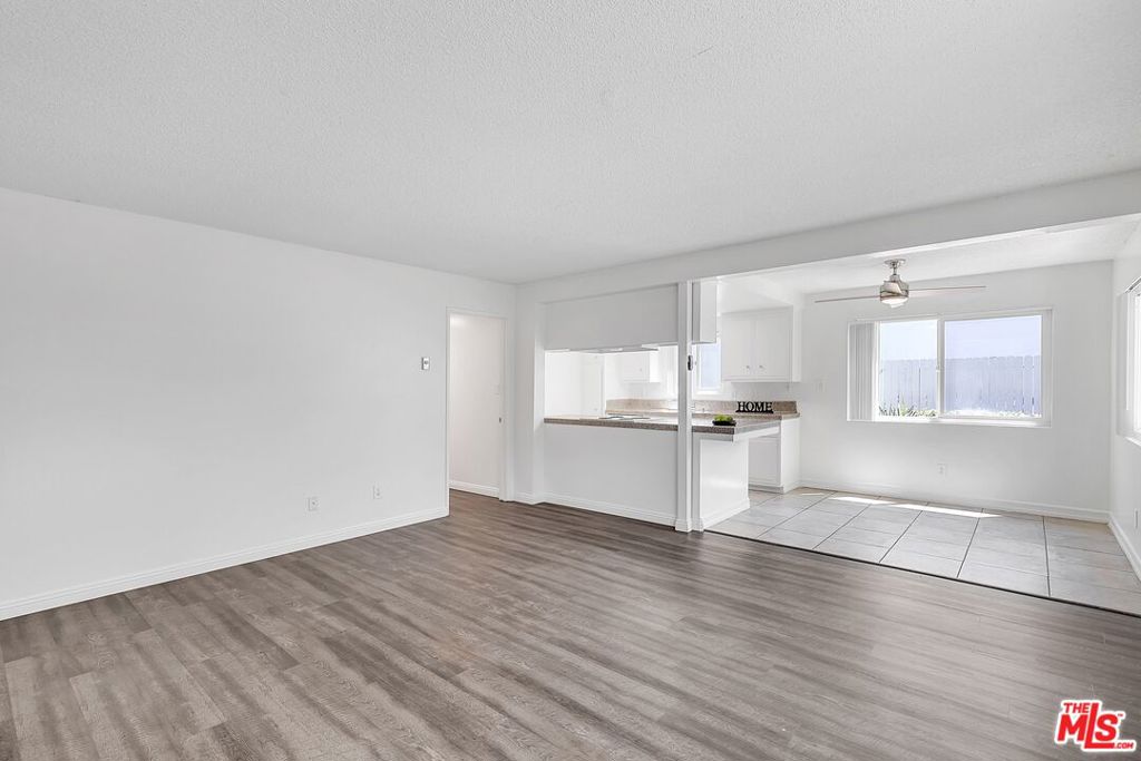 We can't emphasize how much you're going to love living in this lower 2BD/2BA Redondo Beach beauty. We kinda don't want to leave ourselves.Stylish and sophisticated, this unit delivers! The living room features new laminate flooring and large windows, inviting you to linger in this bright, warm space. The kitchen is bedecked too! With stove & dishwasher included, you'll find your inner Chef Ramsey in this kitchen. Bring your own fridge, grab a beverage, and head outside to the lovely private fenced patio. Ooh the opportunities out here! Breakfast, yoga, meditation, you name it!Next let's explore the rest of the unit, which includes two newly carpeted bedrooms, and with one bathroom conveniently located en-suite, and the other located in the hallway leading to the bedrooms. There are new double paned windows throughout. And parking couldn't be easier, with one car shared garage parking (half of a 2 car garage). Shared coin-operated laundry on site. Enjoy all that South Redondo has to offer! So close to the Strand and you're merely a hop, skip & a jump to Riviera Village with its charming shops and eateries, as well as King Harbor and the Pier. You're flanked on either side by two gorgeous neighborhood parks, so take a nature walk, or find some outdoor courts & fields to play your favorite sports on!Come check it out and see for yourself, it's not to be missed!