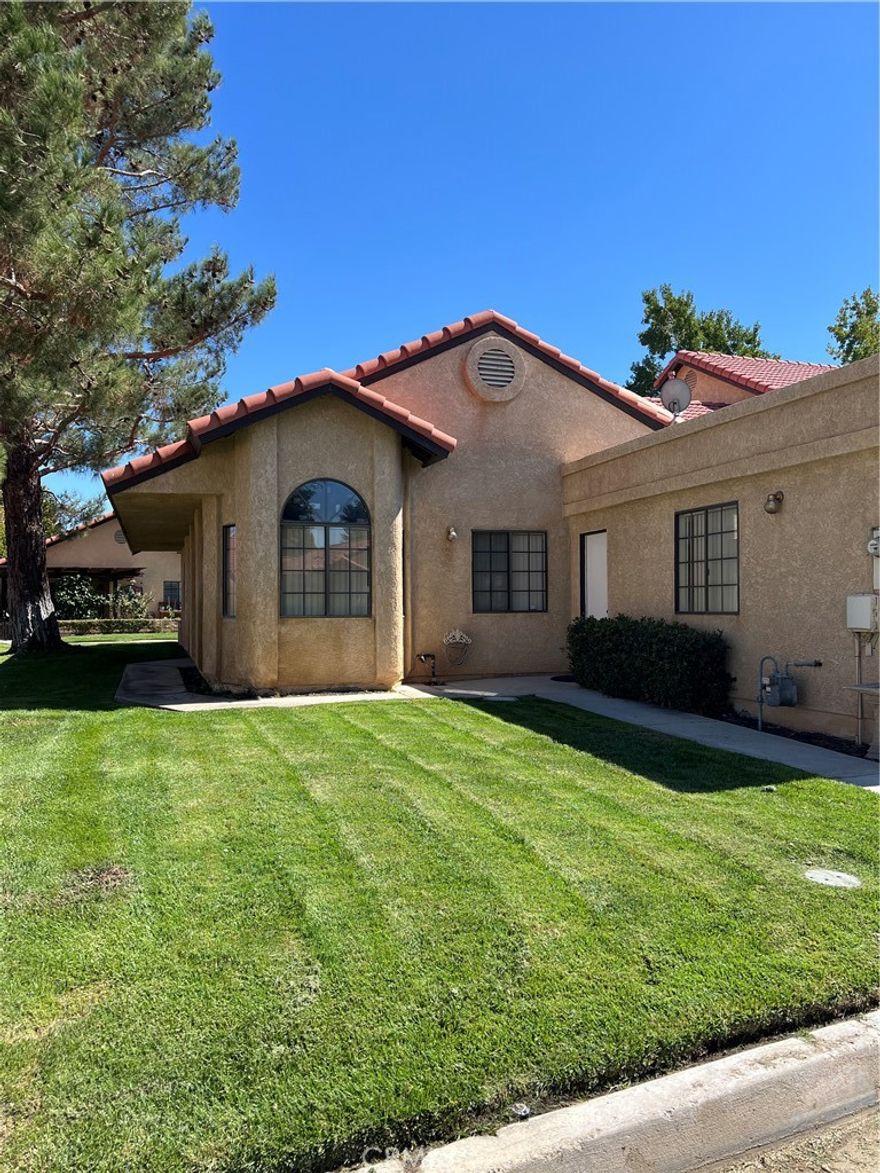 cute and cozy. Living rm with Slider door to patio. Both Bedrooms have access to full Baths. Laundry in one Bathroom with Washer and Dryer. Large closets. Eating Kitchen. Landscaper included. Corner lot with big beautiful trees.
