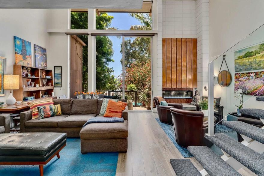 Nestled within the La Jolla Racquet Club off Torrey Pines Road, this architectural treasure is part of a select group of only six distinctive floor plans - a generous 3-bedroom (West of the 5) residence with a view of the glistening pool. The third bedroom, a loft currently utilized as an office, boasts ample closet space and a full bath with a shower. Additionally, the property includes one designated garage space in a private six-car garage near the unit and a second space in the main garage. Remodeled in 2019, this townhome seamlessly marries timeless design with contemporary upgrades, offering a perfect blend of classic mid-century charm and modern coastal living.  Amidst verdant, peaceful landscaping, this home provides both privacy and tranquility, just a brief walk away from La Jolla Shores Beach. Enjoy a plethora of resort-style amenities such as a pool, spa, tennis courts, and clubhouse, all within minutes of the Villages boutique shops, upscale dining, UCSD, and major freeways. The property also features covered parking and two tennis courts, making it an ideal retreat for those seeking the ultimate in coastal living.  For added convenience, there is storage in the foyer behind a mirror, a spacious closet on the deck, and a storage locker. The unit is equipped with a washer and dryer, with easy access from Torrey Pines Road to one of your covered parking spots. Take the stairs to the right for upstairs access or to the left for your front door. To enhance the cozy ambiance of the living room, there is a delightful electric fireplace that radiates warmth and can be illuminated with colored lights.  Sellers are open to concessions, allowing you to experience the epitome of luxury living in this remarkable La Jolla residence.