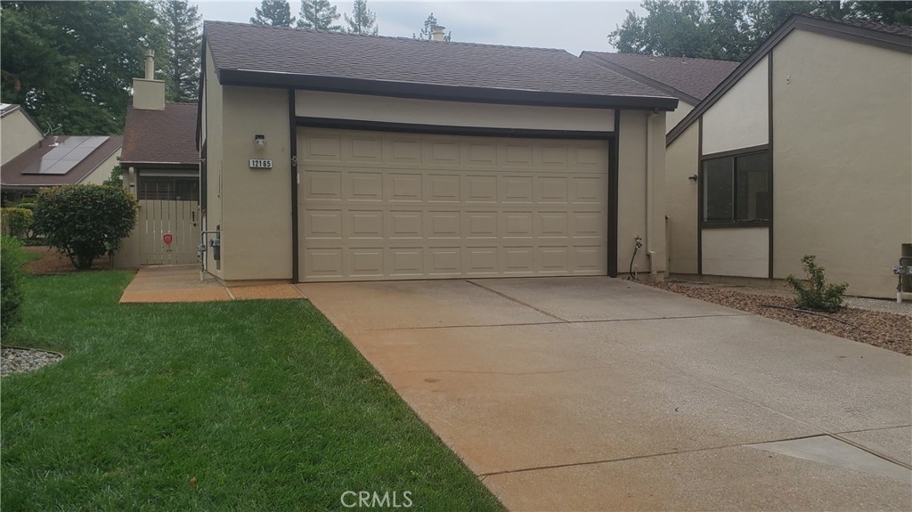 Beautiful Townhouse in Stoneridge located in the lower, secluded section . A large driveway & 2 car garage welcome you home to a quiet & convenient retreat-like setting. With your own private, gated front courtyard entrance, guest parking out front and a large, shade tree & grassy area, you'll enjoy that park-like feel. The inside features an updated, open kitchen with newer appliances, dining area with eating counter and a skylight making it light & bright. The living room offers a vaulted ceiling, woodstove on brick hearth, large windows and a slider to the back patio area. A large master bedroom overlooking your private courtyard, with double closets leading to the ensuite, plus added bonus with pull down stairs to ample attic storage space. Located just down the hall are the guest bedroom, guest bathroom with your own private laundry space. The Stoneridge Association offers beautiful amenities including swimming pool, clubhouse and well manicured grounds tucked away in a private location yet close to all the conveniences Paradise has to offer. All located within easy walkability access to Paradise Performing Arts Center, Paradise Public Library, casual dining & local shopping. Your new home awaits, drive by today for a sneak peek!