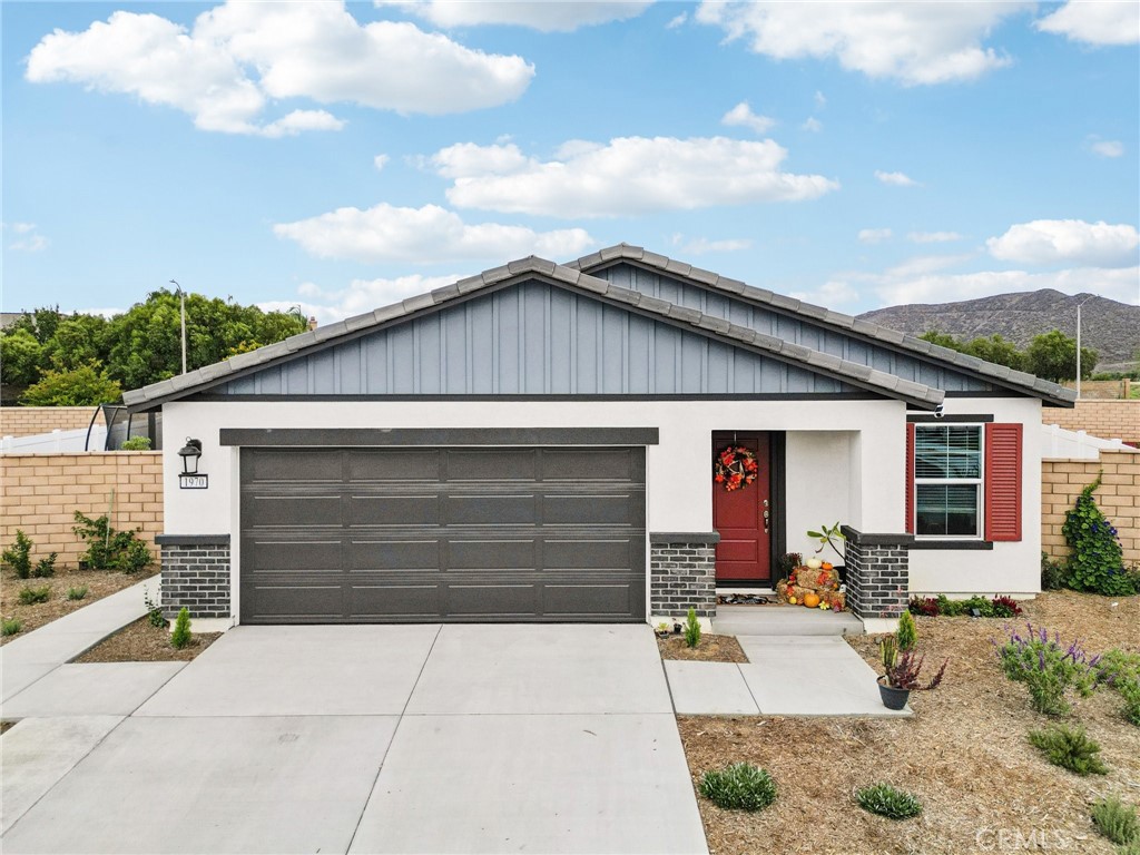 Welcome to your new home in Hemet! Built in 2024, this beautiful single-story residence offers 3 spacious bedrooms and 2 full bathrooms. As you arrive, you’ll be greeted by a charming bright red front door and matching shutters that add a pop of curb appeal. Step inside to discover an open floor plan filled with natural light, featuring a large living area that flows seamlessly into the modern kitchen — perfect for entertaining family and friends. Each bedroom is generously sized, providing comfort and flexibility for the whole family. The backyard is ready for gatherings, complete with concrete areas, low-maintenance mulch landscaping, and a lovely gazebo — ideal for relaxing or hosting outdoor get-togethers. Conveniently located near local shopping, schools, and parks, this move-in ready home combines modern style, functionality, and value. Don’t miss your chance to make it yours!