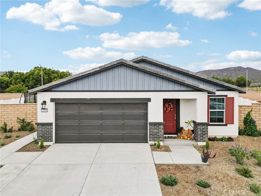 Welcome to your new home in Hemet! Built in 2024, this beautiful single-story residence offers 3 spacious bedrooms and 2 full bathrooms. As you arrive, you’ll be greeted by a charming bright red front door and matching shutters that add a pop of curb appeal. Step inside to discover an open floor plan filled with natural light, featuring a large living area that flows seamlessly into the modern kitchen — perfect for entertaining family and friends. Each bedroom is generously sized, providing comfort and flexibility for the whole family. The backyard is ready for gatherings, complete with concrete areas, low-maintenance mulch landscaping, and a lovely gazebo — ideal for relaxing or hosting outdoor get-togethers. Conveniently located near local shopping, schools, and parks, this move-in ready home combines modern style, functionality, and value. Don’t miss your chance to make it yours!