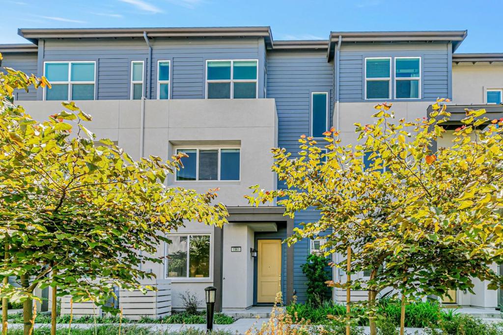 Built in 2020 by luxury builder Toll Brothers, this immaculate 3-bedroom townhouse in Milpitas coveted Parkside community faces the community park and is just steps from Tango Park, a new city park. The ground level features a versatile den ideal for a home office or gym, while the bright and open main level includes a spacious living room, private patio, and a chefs kitchen with quartz countertops, large island, custom cabinetry, pantry, and dining area. Upstairs, the primary suite boasts a walk-in closet, dual vanities, and walk-in shower. Thoughtful upgrades include double-pane windows, energy-efficient appliances, dual-zone AC, water softener, RO system, and a side-by-side 2-car garage. HOA dues cover solar power (on-grid system reducing energy costs), water, sewer, garbage, exterior maintenance, roof, landscaped parks, BBQ area, and playgrounds. Ideally located near the Great Mall, BART, Costco, Trader Joes, and top-rated schools including 10/10 Northwood Elementary and award-winning Morrill Middle, with no rental restrictions.