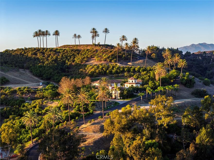 Located atop a commanding hilltop promontory in historic San Juan Capistrano, Casa Grande at Coral Farms is a once-in-a-lifetime opportunity encompassing 42.75 acres with sweeping 360-degree views of the Pacific Ocean, surrounding mountains, city lights, golf courses, and the San Juan Capistrano Mission. Rarely does a property of this scale, location, and entitlement flexibility become available in coastal Orange County.

The estate is anchored by a Spanish Mission Revival 21,500 sq. ft. multi-use building featuring three residences with seven bedrooms and eight baths, office and conference facilities, and garages with parking for up to sixteen cars. Paved roads, underground utilities, gated entries, and abundant storage provide a strong infrastructure foundation for future vision.

Entitlements include permitted plans for a nearly 39,000 sq. ft. Mission Revival primary residence with seven bedrooms, twelve baths, six fireplaces, and unmatched ridgeline views— exempt from the city’s Ridgeline Ordinance. Additional approved uses of the property include guest villas, employee residences, pools and spas, sports courts, barns, stables, and greenhouses. With no architectural review, no permit or plan check fees, and guaranteed, expedited approvals, the property offers development advantages rarely found in California.

Beyond its residential potential, Coral Farms is a thriving agribusiness with existing avocado, citrus, and agave production. Expansion plans and feasibility studies for large-scale agave planting and a boutique distillery are available, presenting opportunities for a farm-to-table estate or a branded agricultural enterprise.

The property also benefits from its enrollment in the Williamson Act, preserving its agricultural open space while dramatically reducing property tax liability. Based on current valuations, annual savings are estimated at more than $660,000, and the contract transfers seamlessly to the next owner.

Located less than 20 miles from John Wayne Airport, five miles from Dana Point Harbor, and minutes from San Juan Capistrano’s train station and equestrian trail system, Casa Grande at Coral Farms combines privacy, accessibility, and heritage. This is more than an estate site—it is a generational acquisition with the ability to create one of Southern California’s great legacy properties.