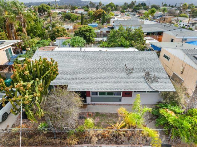 Lovely private haven that has been occupied and cared for by 2 families since the 1960's. A 4 bedroom and 2 full bath bathroom home with a new roof, and newer dual pane windows, covered rebuilt patio. Updated flooring and remodeled bathrooms. Low maintenance landscape and drip irrigation system with an oversized lot and a 35 year old Fuerte avocado tree yielding more fruit than only one family can use. Established succulent gardens. Upgraded electrical and lighted outdoor BBQ. Home is walking distance to Audubon school K-8th grade and public transportation is one block away. Large enough yard enough yard for multiple ADU's, families and Investors welcome!!