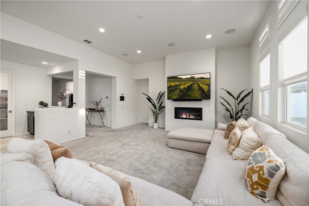 This beautiful 4 bedroom, 4 bathroom single story home offers PAID OFF SOLAR, over 3,000 sqft of living space, and sits on a spacious 7,851 sqft lot in a clean, newer community with no HOA! Built in 2021, this property combines desert modern design with top-of-the-line smart home features and energy efficient upgrades throughout. As you pull up, you're welcomed with gorgeous curb appeal featuring a stone-accented exterior, beautiful drought-tolerant landscaping, an elegant custom front door, and custom-lit concrete stairs that lead you right to the entry. There's also a cozy seating area in the front yard, perfect for enjoying your morning coffee while taking in the peaceful sunrise. Inside, you're greeted with high ceilings, large windows that allow an abundance of natural lighting, and a bright, open floor plan that flows perfectly from the kitchen to the family room, perfect for entertaining guests! The kitchen features granite countertops, stainless steel appliances, a large island with bar seating, beautiful pendant lighting, a walk-in pantry, and shaker cabinets with plenty of storage. The spacious family room is complete with a sleek gas fireplace, built-in Sonos ceiling speakers, and smart blinds that work with the smart home system. Just off the kitchen, you'll find a large formal dining area that's currently being used differently, but offers plenty of room for a full dining setup and is equipped with smart blinds as well. All four bedrooms are generously sized and each offers either a private or nearby bathroom, plus walk-in closets! The primary suite is tucked away for extra privacy and includes a spa-like bathroom with dual sinks, a soaking tub, and a large walk-in closet. Tech lovers will appreciate the fully integrated Control4 + Josh.AI smart home system, CAT6 wiring, fiber internet, smart blinds, energy efficient double pane windows, tankless water heater, and best of all; owned, paid-off solar! The backyard is ready for your dream setup,Whether you envision a lot pool, outdoor kitchen, or relaxing garden. This home is walking distance to Marie Kerr Park, where you can enjoy summer concerts and watch the 4th of July fireworks show right from your yard! Close to Rancho Vista Golf Course, Antelope Valley Mall, shopping centers, restaurants, schools and Freeway for easy commuting.