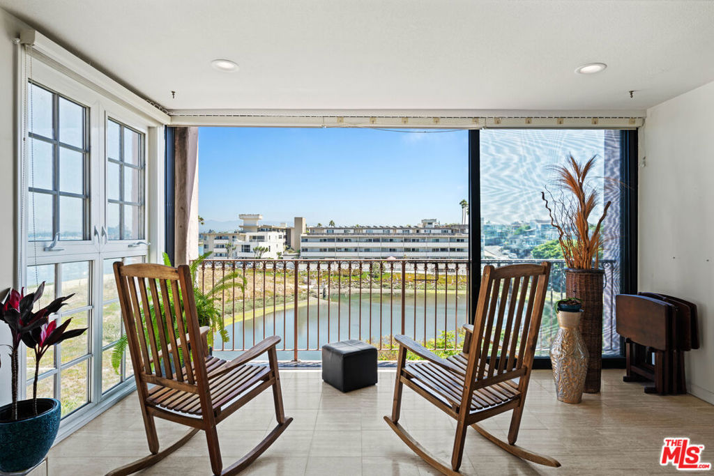 Breathtaking Top-Floor Corner Unit with Unobstructed Water Views! Experience stunning water views of the Marina Channel, Ballona Creek and Ballona Creek Lagoon from this top-floor corner 2-bedroom, 2-bathroom home. As you enter, you're immediately greeted by sweeping vistas that stretch straight down the channel a rare sense of openness and serenity made possible by the absence of nearby buildings. This light-filled unit features hardwood floors throughout, two cozy fireplaces, and floor-to-ceiling sliding glass doors that seamlessly connect indoor and outdoor living while framing the spectacular scenery. The bright, well-appointed kitchen boasts rich Cherry Wood cabinets, high end appliances including a washer and dryer. There's AC, two parking spots, additional private storage in the garage and a shared bike room. Located a short walk to shops, restaurants, and coffee houses, you'll also enjoy direct access to the Marina bike path cruise south to Manhattan Beach or north to Santa Monica along the scenic coastal route. As a crown jewel, the expansive rooftop deck offers a one-of-a-kind vantage point, where you can soak in 360 views of the Pacific Ocean, Marina, jetty, surrounding mountains, and lagoon truly feeling on top of the world. Don't miss this rare opportunity to own a piece of paradise in Playa Del Rey. Murphy bed in the 2nd bedroom not included in the sale price, it's negotiable.
