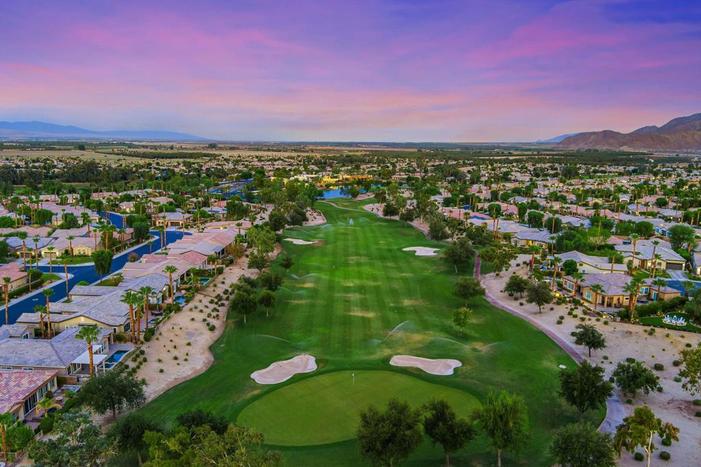This beautifully appointed Tamarisk plan features 4 bedrooms, 4 bathrooms, and a detached casita--perfect for guests or multigenerational living--set on an expansive 12,000-square-foot lot with stunning views of the golf course and mountains. A Tuscan-inspired exterior, featuring a custom entry gate, creates strong curb appeal, while a covered breezeway connects the casita to one of two private side yards. Inside, the open-concept layout is filled with natural light and features tile flooring throughout the main living areas. A gourmet kitchen with granite slab countertops, stainless steel appliances, a wine fridge, and a large center island opens to the spacious great room. The backyard is a true desert oasis, complete with a large pool, raised spa, multiple waterfalls, dual covered patios, and ample space for entertaining. The luxurious primary suite includes patio access, a Jacuzzi tub, dual vanities, a walk-in shower, and a large walk-in closet. Additional highlights include a built-in media center, custom window treatments, stone finishes in all bathrooms, and a 3-car garage, making this one-of-a-kind home the perfect blend of comfort, style, and resort-style living. Come experience the newly renovated golf course and vibrant new restaurant, Kitchen Ten Eleven, and enjoy everything the Trilogy lifestyle has to offer.