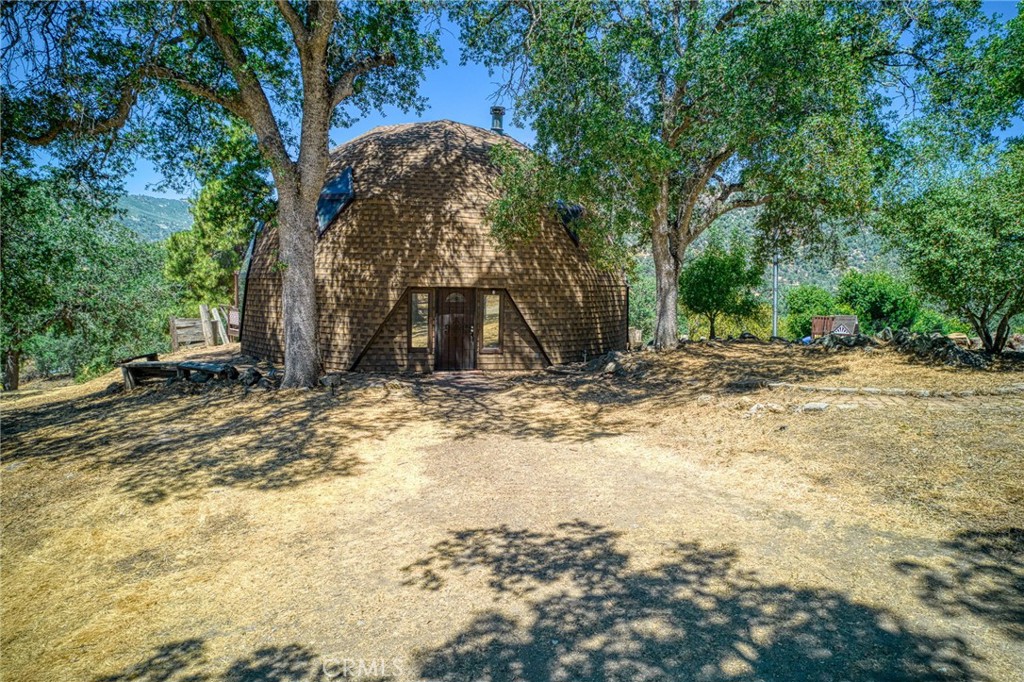 Escape to something extraordinary. Nestled on 2.45 private acres in scenic Tollhouse, CA, this geodesic dome home offers a rare blend of architectural charm, energy efficiency, and rural serenity. With soaring ceilings, panoramic windows, newer HVAC and a design that maximizes airflow and insulation, this home is as practical as it is beautiful.
Whether you're seeking a weekend retreat, full-time homestead, or creative getaway, this property delivers space, privacy, and potential. Ample acreage allows for gardening, animals, or expansion - and nature is your nearest neighbor.
Come experience a home that truly stands apart from the rest.