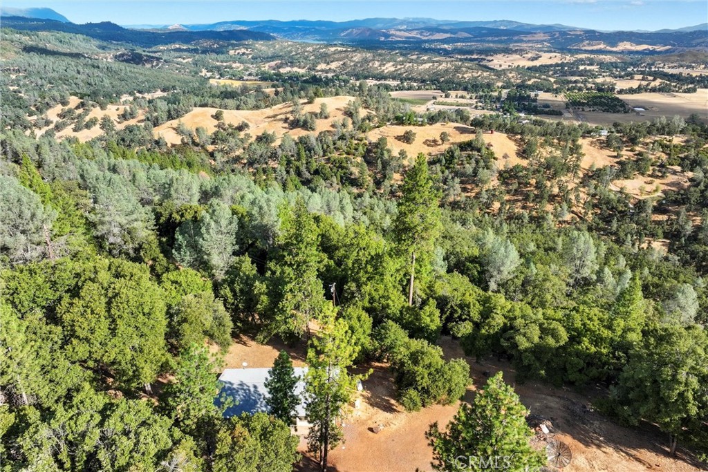 Escape to your own private retreat on nearly 40 acres of rolling land, where peace, privacy, and stunning views await. This spacious 1,792 sq. ft. home offers 2 bedrooms and 2 bathrooms, perfectly positioned to take in the beauty of the surrounding landscape. Two active springs, a 148-foot well, and a conventional septic system provide self-sufficiency, while a whole-house generator ensures you’ll never be without power. Multiple outbuildings add space for storage, hobbies, or ranch use, giving you flexibility for a variety of needs. Whether you’re dreaming of a homestead, a recreational getaway, or simply a quiet place to take in wide-open skies, this property delivers. With panoramic vistas, abundant natural resources, and room to roam, it’s the ideal blend of comfort and country living.
