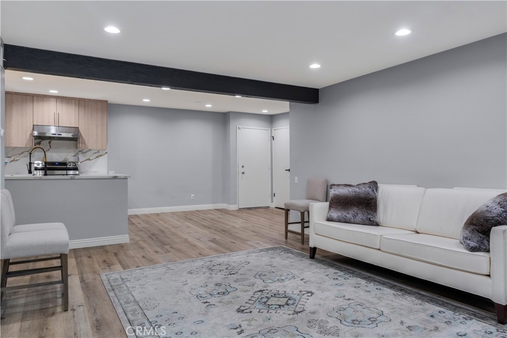 This rare, fully remodeled 2-bedroom, 2-bath corner unit with one common wall offers the ultimate blend of privacy, convenience, and turnkey luxury. Situated on the ground floor with no stairs and a private entrance, it provides effortless access from the parking area—bypassing the main building entry entirely. A true standout in the complex, it features two side-by-side parking spaces that can accommodate up to four vehicles. The spacious, light-filled layout includes dual master suites positioned on opposite sides for optimal comfort and separation. The open-concept living area flows beautifully to a serene courtyard, creating an inviting indoor-outdoor feel. All furniture stays with the home making this home move-in ready with every detail considered. Residents enjoy resort-style amenities including two pools, a spa, gym, clubhouse, tennis courts, jogging path, BBQ area, and 24-hour security. Ideally located just off Ventura Blvd, you're minutes from shops, dining, Trader Joe’s, and the 101 Freeway—making this one-of-a-kind unit a rare and unbeatable opportunity.
