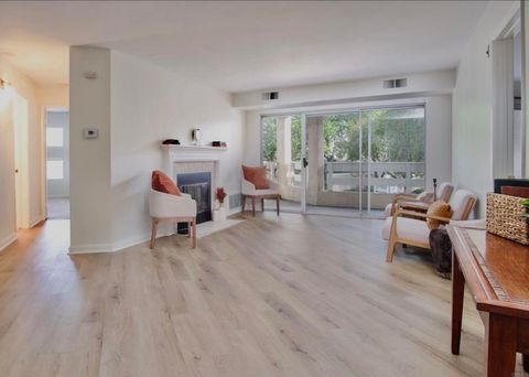 Photo of 7067 Camino Revueltos #310, San Diego, CA 92111 (MLS # PTP2601040)