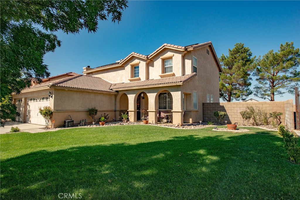 Stunning and spacious home with everything you've been looking for! Features include beautiful tile floors, a remodeled open-concept kitchen that flows into a huge family and dining room-perfect for entertaining. Downstairs offers a private guest bedroom with full bath and a separate laundry room. Upstairs features an oversized master suite with luxurious bath, plus three additional large bedrooms and another full bath. Enjoy the expansive backyard with a concrete patio, ideal for gatherings. 3 car garage with ample storage. Bonus: pool table and washer and dryer included in the sale! Located in a peaceful neighborhood with a park like front lawn-- perfect for relaxing while the kids play! Conveniently close to freeways, shopping, and dining and more. This home truly has it all-- don't miss it!