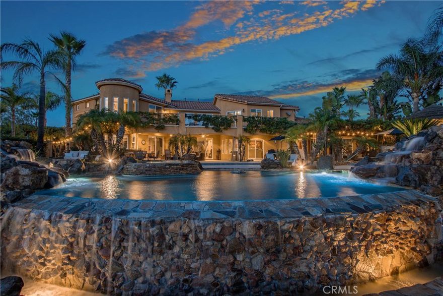 Set on 2.5 acres in the heart of Temecula’s wine country, this hilltop estate pairs privacy with sweeping views. A private gated drive leads up to the 4,656 sq ft home, where thoughtful design and custom craftsmanship are on display from the moment you step inside.

The interior is open and inviting, with tall ceilings, expansive windows, and a layout that flows naturally for both everyday living and entertaining. The kitchen connects seamlessly to the living spaces, while a temperature-controlled wine cellar adds a unique touch.

Outdoors, the saltwater infinity pool edged with locally sourced stone feels like a natural extension of the landscape. Multiple patios and covered spaces make it easy to host friends or simply unwind while taking in vineyard sunsets. Full RV Hookups and two oversized two-car garages with EV hookups and built-in shelving. 

Just minutes from shopping, dining, and world-class wineries, this estate blends comfort, function, and the beauty of wine country living.
