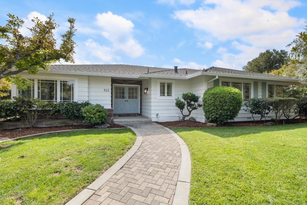 Located on a large corner lot of more than one-quarter acre, this freshly updated classic ranch home is just one-half mile from The Village of Los Altos. Hardwood floors, crown moldings, and abundant natural light define the interiors, along with glass doors that connect the living room, family room, and primary suite to the pool and spa. The well-appointed, skylit kitchen features maple cabinetry, granite counters, and premium appliances, plus breakfast bar seating at the island. The adjacent family room is a focal point with its cathedral ceiling of exposed wood, fireplace, and built-in cabinetry. A spacious formal dining room with new chandelier adds to the appeal. The homes three bedrooms are privately located in a separate wing, highlighted by the primary suite with updated bath and curbless shower. Wraparound, low-maintenance grounds culminate at the pool and spa with expansive patio space bordered by mature trees and fruit trees all in a very private setting. Adding the finishing touch is the homes access to excellent Los Altos schools.