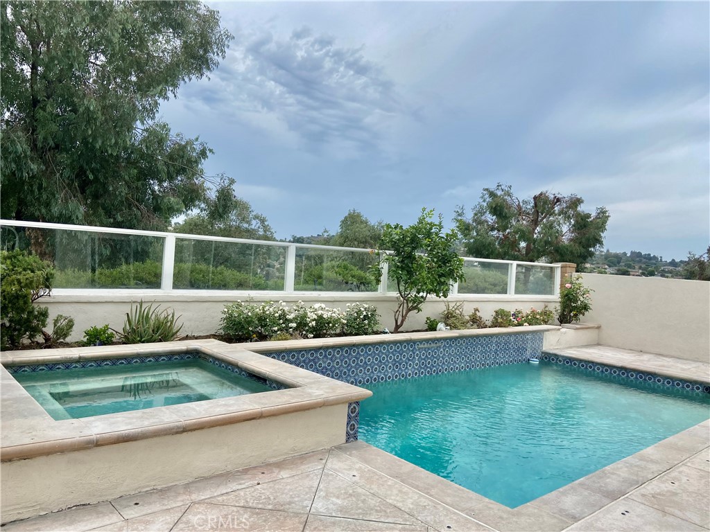 Two-Story Single Family with Greenery View located on a single loaded street with close proximity to shoppings, resturants and I-5 Fwy. The property consists of main floor bed room, Formal living room with high ceiling, family room with a Fireplace, newly upgraded kitchen and a spiral staircase that leads to master bedroom. two secondary bedrooms and a large Den functional as an additional room, LED recess lightings & laminated wood flooring throughout the House, Private Pool & Jacuzzi. Association Pools & SPA, Tennis Courts, Gym, Indoor Racquetball and More........!