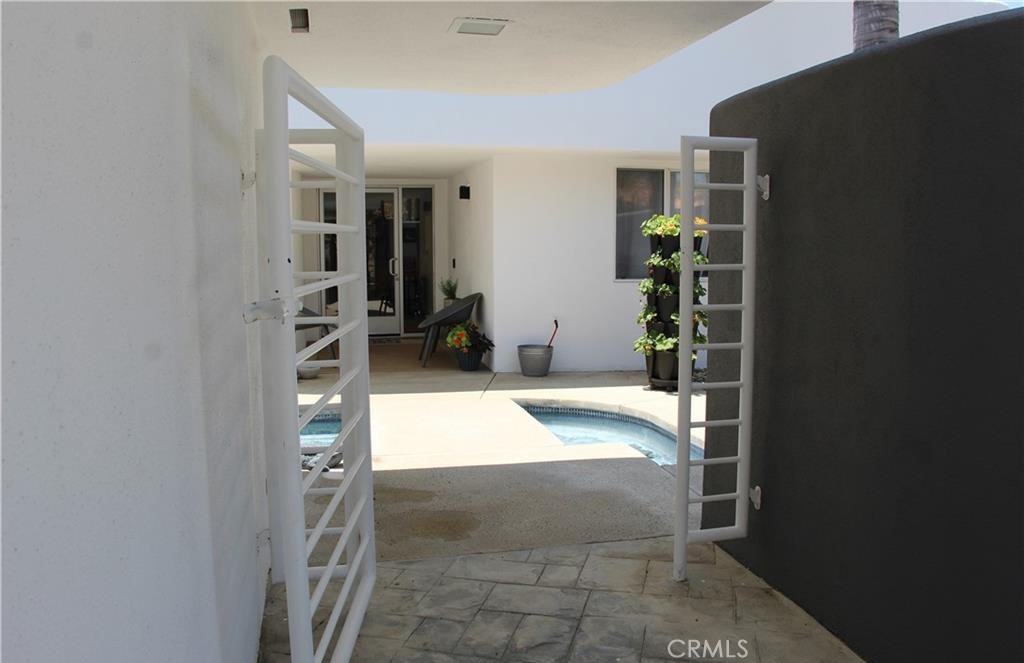 Welcome Home to this beautiful studio casita. It is a separate space that is attached to the main house, with a private entrance and accommodations. This casita has been fully updated with a stainless steel refrigerator, updated countertops and cabinets, a 3 in 1 new convection appliance which functions as an air fryer, microwave oven, and 2 burner induction stove top. The casita has new flooring throughout and comes furnished with a full-size bed with a tuft & needle mattress, dresser, wardrobe, and small dining room table and chairs. The bathroom has a large stand-up shower and updated finishes. Water, trash, electricity, gas, and Wi-Fi are all included in the rent payment! The entrance to this pretty space is via the front courtyard and over a beautiful pond water feature. Future tenant (s) have access to and are free to enjoy the residents sparkling private pool. You don't want to miss out on this little retreat!