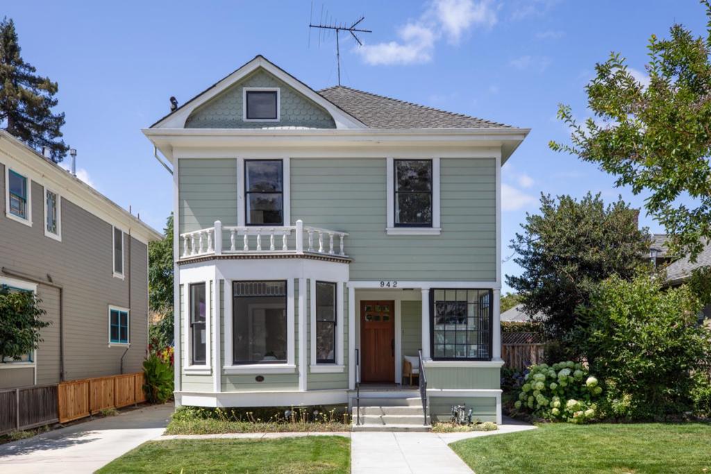 Incredible and convenient location just blocks from downtown Palo Alto, this classic Queen Anne-style home blends architectural history with modern comforts. Surrounded by lovely homes this circa 1904 classic home features iconic fish-scale shingles, a front bay window, and a divided-light glass-enclosed porch. Period details include wainscoting, pocket doors, bay windows, and a built-in china cabinet, complemented by updates such as wood-style flooring, updated lighting, remodeled baths, and remodeled kitchen with cherry-toned cabinetry, granite counters, stainless steel appliances, and a walk-in pantry. The main level includes formal living and dining rooms, a full bath, laundry room with leaded-glass door to the yard, and a bright kitchen. Upstairs offers a primary suite with large closet and updated bath, plus two additional bedrooms served by a remodeled hall bath. A spacious attic with dropdown stairs adds bonus potential. The lot seems remarkably deep, with a generous patio and surrounded by privacy trees and lush landscaping on this south-facing lot. Ample driveway parking and all conveniently located in a fantastic downtown location, close to Whole Foods, University Ave, Stanford University, and top Palo Alto schools.
