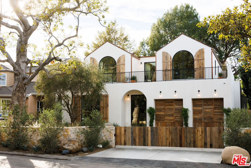 Located on a quiet tree lined street within Longridge Estates sits this new construction masterpiece. The grounds have been artfully curated with a detached full-service guest house. The orientation of shapes and texture has been executed with brilliance. Two A frames sit above large center mass giving way to upper floor deck gardens. The sequential progression of spaces have been mindfully crafted using texture, light and the unexpected. Upon entering the grand center hallway, you are met with sanded limestone, oak encased large beams and Apparatus studio lighting. A large private den/bar area sits tucked in with a private courtyard great for entertaining. Primary living room, dining room and kitchen are flanked by large steel Euroline steel doors systems. A fully-equipped prep kitchen sits proudly behind the main kitchen perfect for large gatherings. A grand center staircase with fluted clay walls, custom brass handrails and overhead lighting lead you to the upper floor landing area with 14-foot steel skylight and garden views. Primary bedroom shows restraint using a barreled clay ceiling, vintage lighting and custom woven linen drapery. Dual closets grounded by white oak cabinetry, custom hardware, vintage makeup mirrors and Sub-Zero refrigeration. The primary bathroom is curated with Calcutta Marble, massive shower stall with steel door leading you to an outdoor garden bathtub, Samuel Heath water fixtures and lighting from Allied Maker. The private and stunning rear yard boasts a full-service guest house, large black bottom pool, infrared sauna, fire pit sitting area and ample space to both entertain and relax. Rob Diaz, Mark Alexander and Anastasia Ratia spared no expense or detail in creating this timeless jewel. Square footage is as follows main house - 4,535/Upper floor open decks - 1,254 sf/ADU - +/- 500 sf.