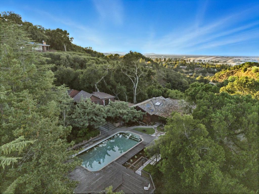10 minutes from Downtown Los Altos and Page Mill Rd yet a world away, this 1.3+ AC property offers commanding Bay vistas, privacy and lush surroundings. Renovate and expand the existing home or build on this incredible, mostly flat site. Three existing structures on site including the 1,800+ sq.ft. main house, 400+ sq.ft. (per plans) detached studio and generous 2 car garage. Multiple spaces to gather and relax on the expansive 1.3+ AC lot. Less than half-a-mile from local favorite, Foothill Nature Preserve with extensive hiking trail system and picnic areas. Panoramic Bay views, privacy, seclusion and the opportunity to create your dream home in bucolic Los Altos Hills!