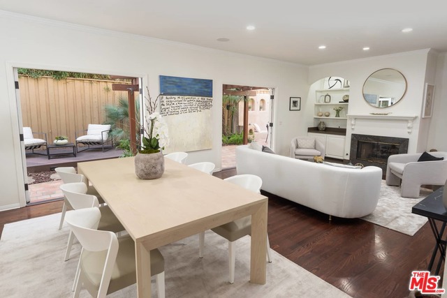 Incredible opportunity to own a detached townhome with private outdoor patio in an A+ West Hollywood location. Situated conveniently between Melrose and Sunset in a charming gated enclave of only four units, this two story townhouse lives like a single family home. The first floor of this Spanish-style townhouse features; open plan living room with fireplace, dining area, and dual French doors leading to your own private outdoor patio. Beautifully landscaped, your private and fenced yard area offers a built-in BBQ, seating & space to entertain and enjoy al-fresco dining. Direct access garage leads into kitchen with eat-in banquette. Second floor offers; soaring ceilings throughout, along with two large bedrooms both w/ en-suite full bath along with a large office/den area with custom built-ins and direct access to a private outdoor terrace. With no shared walls, walking distance to all of the world class amenities on Melrose and the Sunset Strip, this is a rare offering.