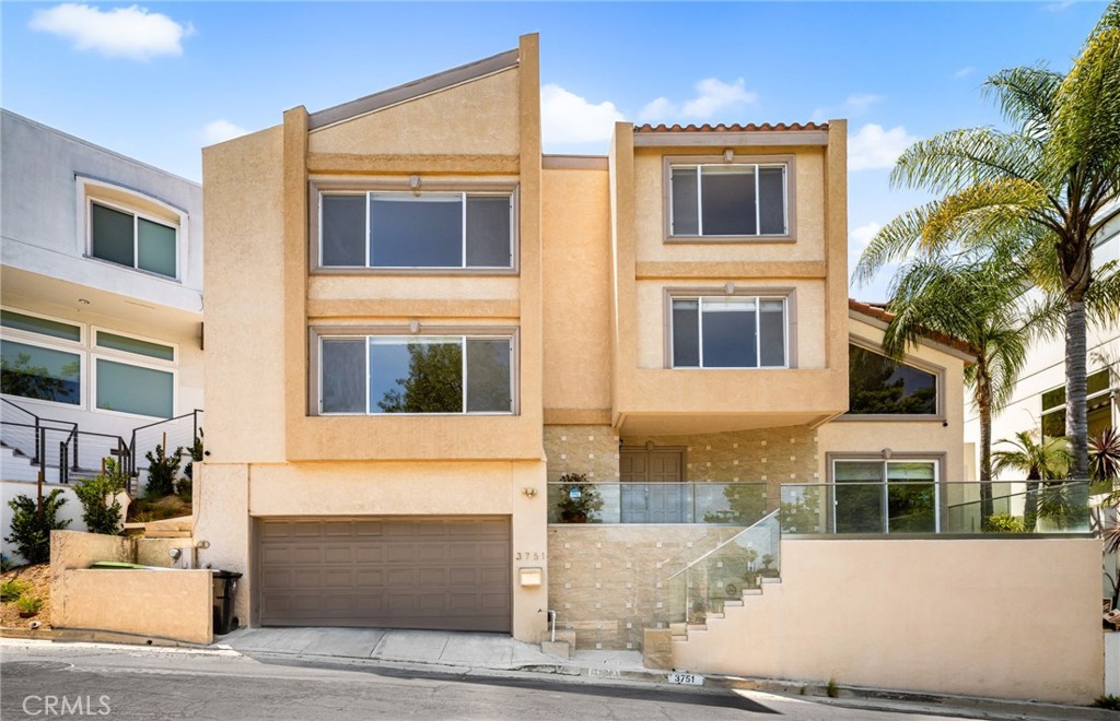 Elevated in the scenic hills of Los Feliz, this beautifully updated multi level residence blends modern design with everyday comfort. A dramatic tile entryway and soaring vaulted ceilings welcome you into a bright, open living space anchored by a cozy fireplace. The open layout kitchen is designed for both function and style, featuring quartz countertops, a sleek tile backsplash, generous cabinet space, and a large center island perfect for casual dining or entertaining. New glass railings installed inside and out. Upstairs, a spacious open loft serves as a versatile family room or creative workspace. An additional Office / Flex Room provides additional flex space for those working from home. Each bedroom includes its own en suite bath, offering privacy and convenience for every member of the household. The primary suite features a renovated bathroom complete with dual vanities and a modern walk-in shower. Enjoy sweeping city lights and tranquil treetop views from multiple vantage points. Additional highlights include laminate flooring throughout, dual-pane windows, recently updated HVAC and recessed lighting. Location in a peaceful neighborhood, ideally located near popular shops, cafes, and hiking trails—and zoned for the award winning Franklin Elementary School—this home delivers the full Los Feliz package!