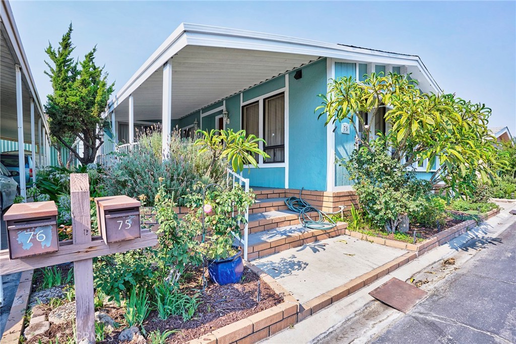 2074 sq ft, Triple-Wide Home, Quiet location across from the guest parking. One of the larger floor plans at the Prestigious Anaheim Shores Estates. This family park has large green belts and wider streets. The clubhouse amenities include a pool, spa, clubhouse with kitchen, card room, billiard room, multipurpose room, BBQ, and covered picnic area. The formal living room and formal dining room have beamed vaulted ceilings and a built-in China cabinet/hutch. The kitchen has lots of cabinets and counter space and is open to the formal dining room and family room. The family room has a slider to the patio. The master bedroom is huge with a double walk-in closet with mirror closet doors and another closet near the master bathroom. The AC/Furnace/oven, and roof have been replaced. Move-in condition. Centrally located to the 91 and 5 Freeways!
