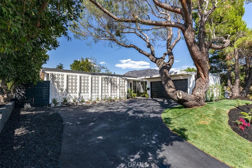 GREAT VIEWS IN THE SAN FERNANDO VALLEY!!! Welcome to a peaceful 4-bedroom, 2-bathroom hillside retreat in the scenic and prestigious Crystal View neighborhood of Tujunga. Completely remodeled this home features a new roof, new windows, a new electrical Panel and a new water heater--every detail thoughtfully updated. This home is perfectly perched to capture breathtaking mountain views...Inside, expansive picture windows flood the open-concept layout with natural light. The open-concept design flows into a chef's kitchen with quartz countertops, custom cabinetry, stainless steel appliances, and an island perfect for entertaining. The updated kitchen and bathrooms are equally refined, with new finish and fixtures throughout...Step outside to your private backyard oasis, with a sun-drenched patio, and mature trees await. Enjoy your morning coffee or sunset while taking in panoramic mountain views--all with no freeway noise, a rare luxury for view homes in the area. Additional highlights include multiple outdoor living spaces, an attached 2-car garage, and close access to hiking trails. This one-of-a-kind property offers the ultimate blend of comfort, nature, and refined California living.