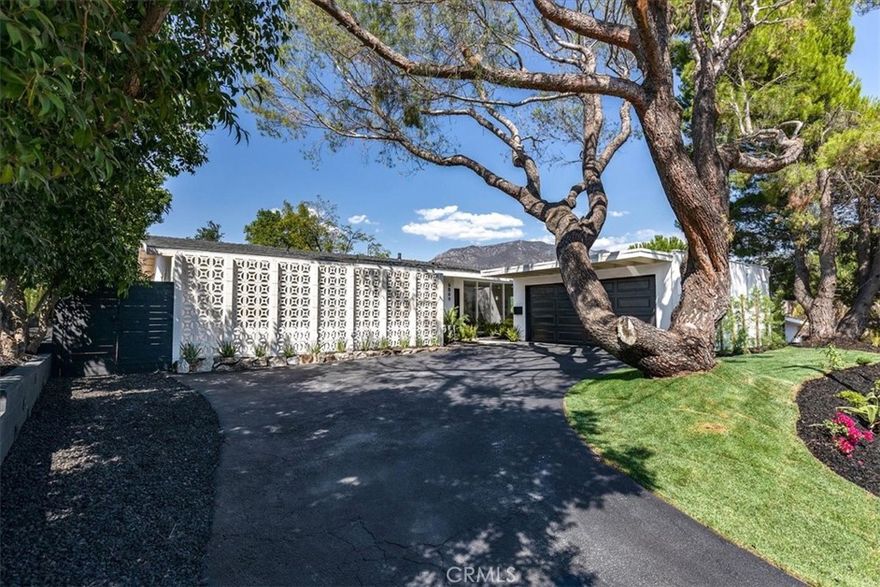 GREAT VIEWS IN THE SAN FERNANDO VALLEY!!! Welcome to a peaceful 4-bedroom, 2-bathroom hillside retreat in the scenic and prestigious Crystal View neighborhood of Tujunga. Completely remodeled this home features a new roof, new windows, a new electrical Panel and a new water heater--every detail thoughtfully updated. This home is perfectly perched to capture breathtaking mountain views...Inside, expansive picture windows flood the open-concept layout with natural light. The open-concept design flows into a chef's kitchen with quartz countertops, custom cabinetry, stainless steel appliances, and an island perfect for entertaining. The updated kitchen and bathrooms are equally refined, with new finish and fixtures throughout...Step outside to your private backyard oasis, with a sun-drenched patio, and mature trees await. Enjoy your morning coffee or sunset while taking in panoramic mountain views--all with no freeway noise, a rare luxury for view homes in the area. Additional highlights include multiple outdoor living spaces, an attached 2-car garage, and close access to hiking trails. This one-of-a-kind property offers the ultimate blend of comfort, nature, and refined California living.