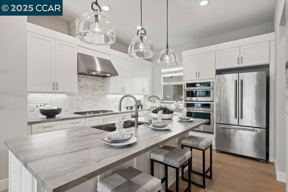 Connect with what matters most at Terraces at The Station, a new townhome community in Sunnyvale, the heart of Silicon Valley. The Station's prime location puts you close to every want and convenience, from easy access to transit and proximity to shopping and dining nearby. In this home leading up from the stairway, the bright main living level makes an immediate impression, presenting alluring views of the spacious great room and outdoor covered balcony. The kitchen is expertly crafted, with stainless steel appliances, 36" gas cooktop, wraparound counter and cabinet space that surrounds a center island with breakfast bar. Secluded on the third floor, the primary bedroom suite features a generous walk-in closet primary bath complete with a dual-sink vanity, luxurious shower with seat. The sizable secondary bedroom features a roomy closet and a private bath with an additional bedroom conveniently located on the first floor. Fourth floor is a stunning spacious terrace. Community clubhouse, indoor/outdoor lounge area, fireplace, bocce ball court, dog park, walking paths and expansive lawns. Terrace at the Station is located near Santana Row, Valley Fair Mall, Shopping Centers. Close to VTA Light Rail, Lawrence Caltrain and Bart. (photos not of actual home, for marketing only)