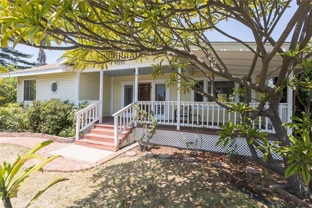 Welcome to 1205 Central Ave, a charming Craftsman home ideally located in the lower Raymond Hills area, directly across the street from Raymond Elementary School. This unique property boasts an additional living space in the back, complete with convenient alley access. The main house offers approximately 1,767 sq ft of living space, featuring 3 bedrooms and 2 baths, a spacious living room, a family room with a cozy fireplace, and an inside laundry area. The living space in the back provides an additional 468 sq ft of living space with 1 bedroom and 1 bath, making this home ideal for multi-family living. You'll love the large front porch, perfect for enjoying cool summer evenings, and the expansive covered deck in the backyard, designed for entertaining family and guests. The home shows light and bright with abundant windows, a skylight and an open floor plan complemented by beautiful wood and tile flooring throughout. Originally home structure was moved to this location in 1988 from Wilshire Ave, the main house has been well maintained by its original owner, and this is the first time it has been on the market. Its great location offers walking distance to award-winning schools, Downtown Fullerton, Fullerton College, Cal State Fullerton, various restaurants and shopping centers, and easy access to the 91 and 57 freeways. The supplement has the floorplan of the home. Make your offer and get ready to call this one HOME today!