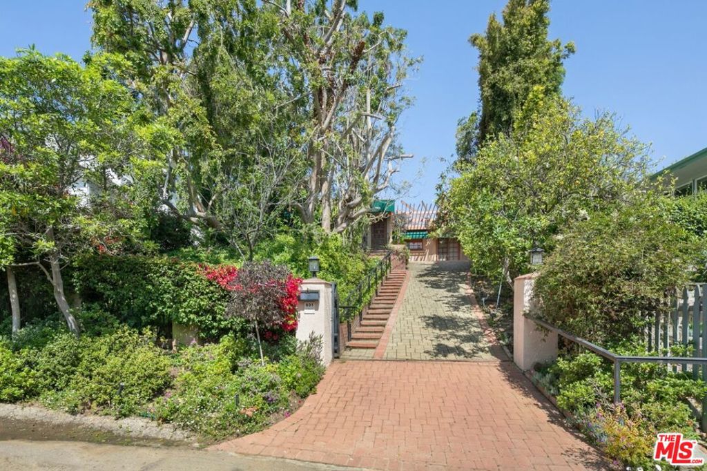 Bring your imagination or designer. This beautiful setting offers endless possibilities to remodel, expand, or build your dream home. Discreetly hidden behind gates, this charming 2-bedroom home in the heart of Pacific Palisades blends endless possibilities. Situated on a quiet, tree-lined street, the property features 2 spacious bedrooms, each with a walk-in closet and a full en-suite bathroom, providing comfort and privacy. As you enter, you will be greeted by open-concept living and dining areas that are filled with natural light and designed for modern living. Don't miss the opportunity to transform this exceptional property in one of Los Angeles' most desirable neighborhoods.