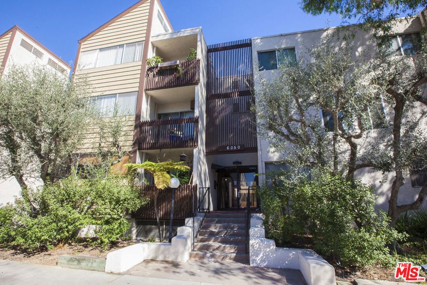 Enjoy quality living in this updated corner end unit in the popular 'Pines' complex with lush manicured grounds, inviting outdoor pool and sundeck, gym, controlled access with patrolled nightly security, and recreation room with on-site manager. Step inside the open and light-filled living space featuring wood laminate floors and recessed lighting. The contemporary galley kitchen with granite countertops and new dishwasher and microwave opens to both the dining area and spacious living room with a large wall of windows and private balcony affording breezy and peaceful treetop views. Enjoy two private and comfortable bedrooms with recessed lighting and abundant closet space with organizers. Laundry room close to unit and convenient gated subterranean SxS parking near the elevator. Centralized neighborhood location with parks and recreation, shopping mall, restaurants, grocery stores, major streets and freeways, LAX, Playa Vista, Downtown Culver City, and beaches nearby.