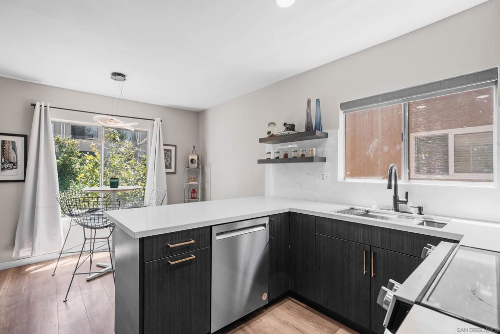 SOARING ceilings and INCREDIBLE natural light welcome you as you enter this grand, TOP floor unit. UNIT HAS NEW LVP FLOORING AND KITCHEN!! Located in the award-winning Poway Unified School District and walking distance to Westwood Elementary. The well-maintained, gated grounds that this beautiful home is located within are truly breath-taking, with multiple ponds, mature landscaping, large community pool/spa, recreation room, fenced playground, and covered picnic areas to enjoy. They don't make communities this beautiful anymore. Easy access to freeways, restaurants, coffee shops, and shopping. HOA includes water and trash!